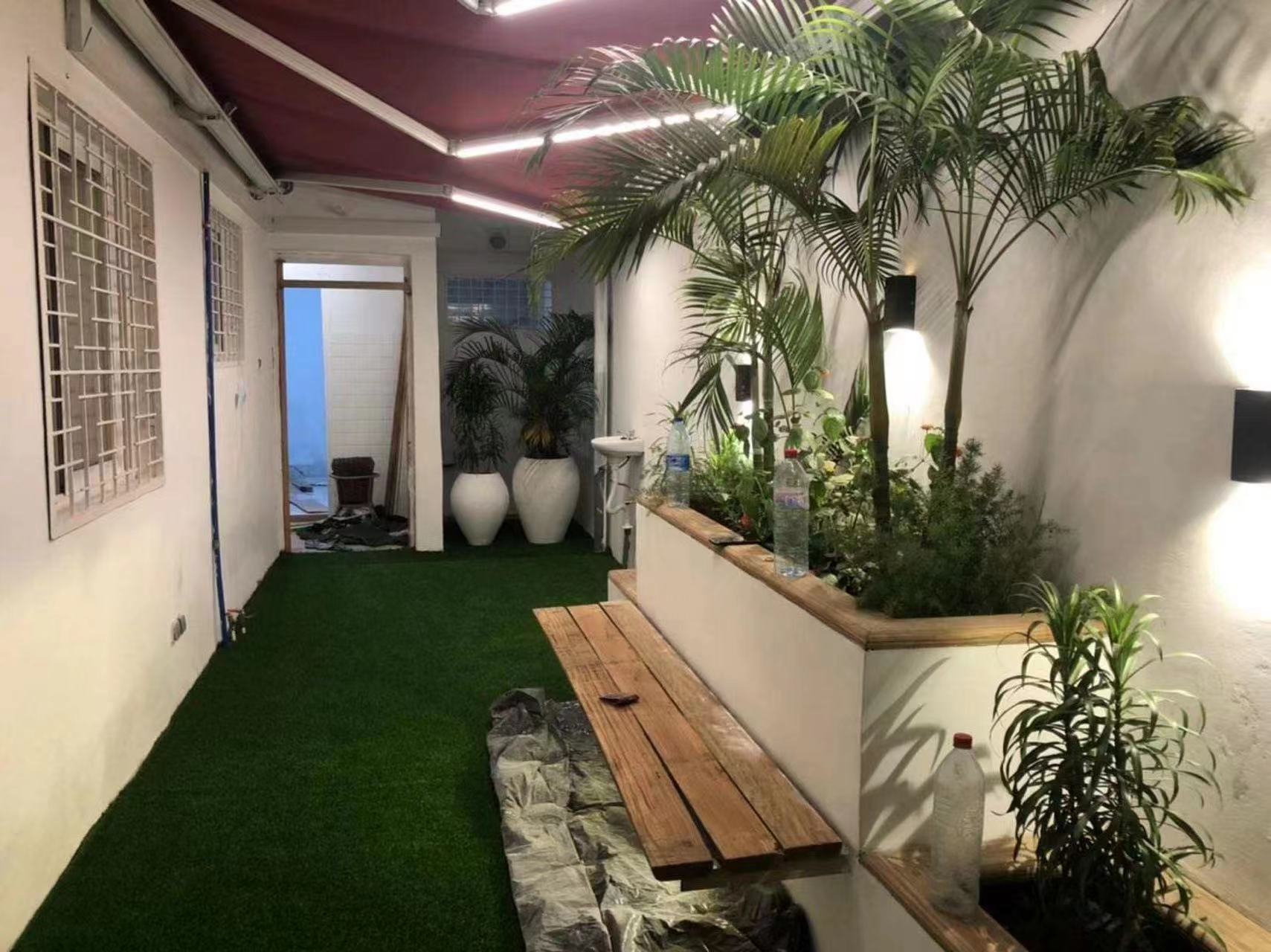 Simulated plastic turf, also known as fake turf